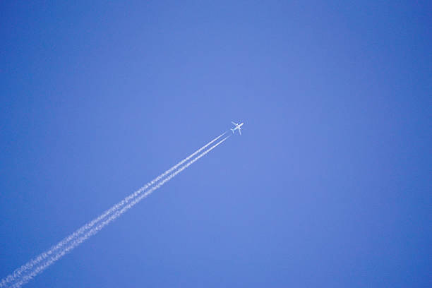 istock Aeroplane trails with blue sky for travel background purpose 467854450