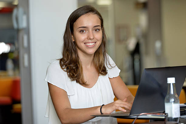 istock One young female adult student studying in a library 467859066
