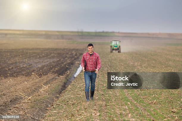 Farmer With Laptop And Tractor Stock Photo - Download Image Now - Farmer, 2015, Adult