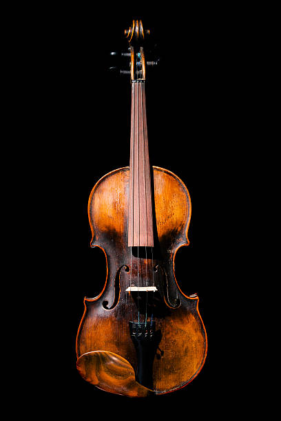 istock Gorgeous antique violin isolated on black background 467862382