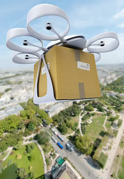 3D rendering of a commercial drone carrying a box flying above a city center