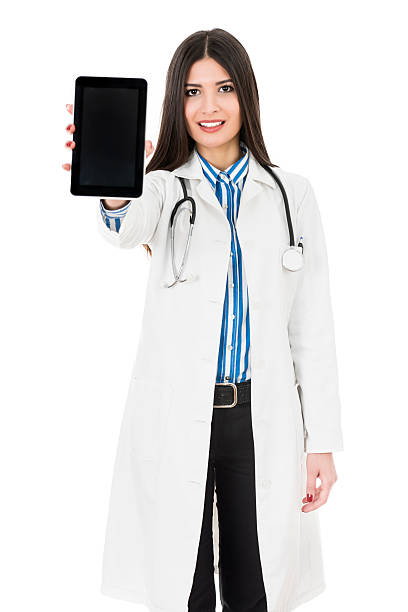 istock Young Attractive Female Doctor Holding Digital Computer Tablet 467863088