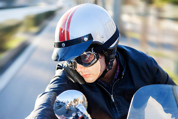istock portrait of young biker riding his motorcycle 467863628