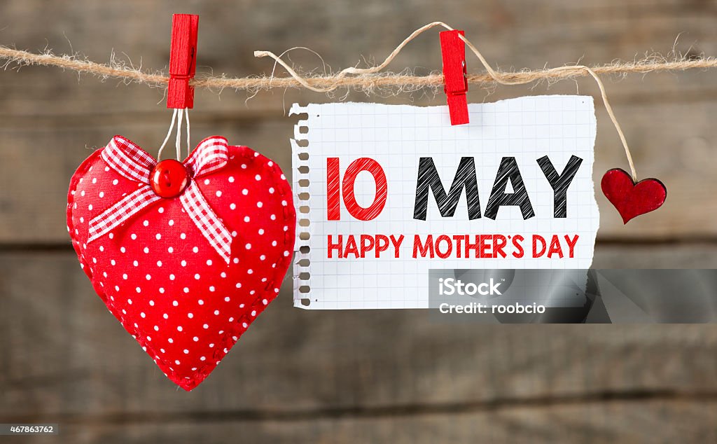 May 10 Happy Mother's day message Happy Mother's day message written on paper ,handling on rope with hearts 2015 Stock Photo