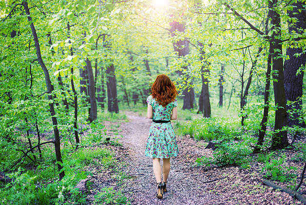istock Beautiful woman in the park 467866874