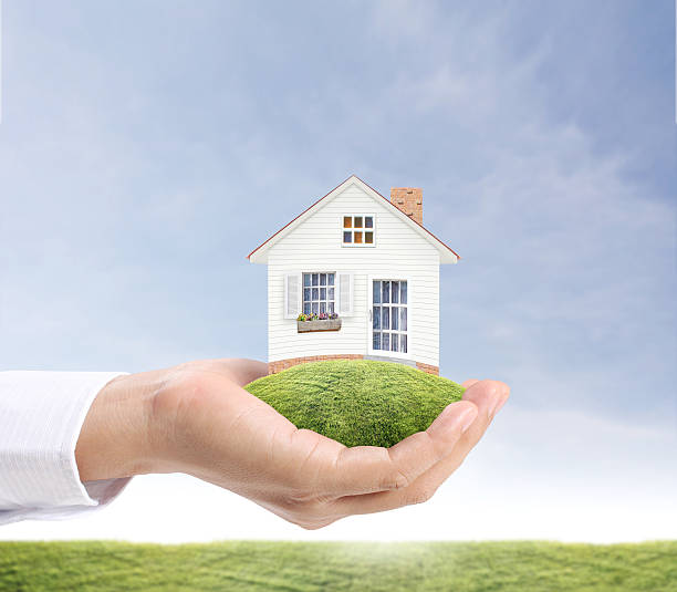 istock holding house representing home ownership 467866985