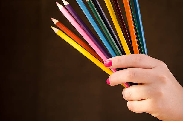 istock girl holding a pencils 467867171