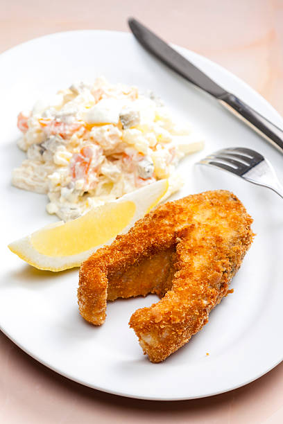 istock fried carp with potato salad 467867226