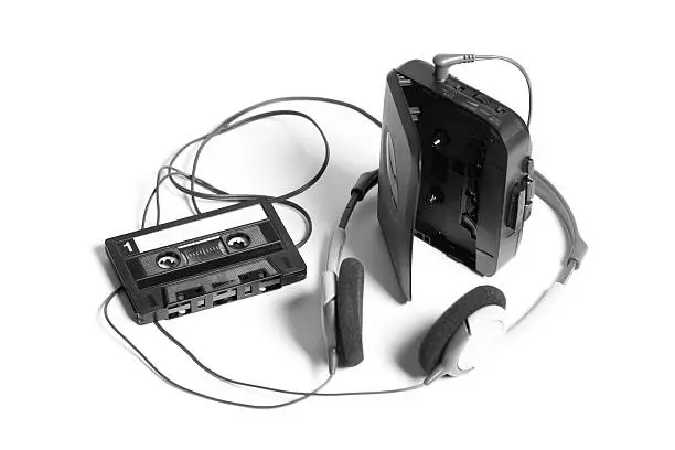 old walkman with headphones and cassette