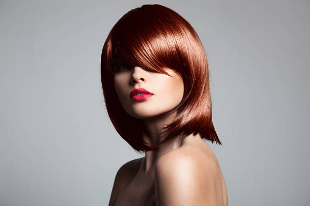 istock Red head with silky hair cover one eye 467867448