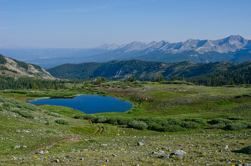 The Great Plains meet the Rocky Mountains in Wyoming. The state is a great plateau broken by a number of important mountain ranges. In the northwest are the Absaroka, the Owl Creek, Wyoming, Gros Ventre, Wind River and the Teton ranges. In the north central are the Big Horns; in the northeast, the Black Hills; and in the southern portion of Wyoming, the Laramie, Medicine Bow and Sierra Madre ranges.