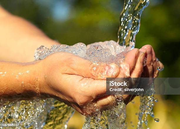 Womans Hands With Water Splash Stock Photo - Download Image Now - Adult, Balance, Below
