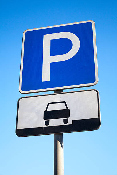 istock Blue parking road sign on blue sky background 467870126
