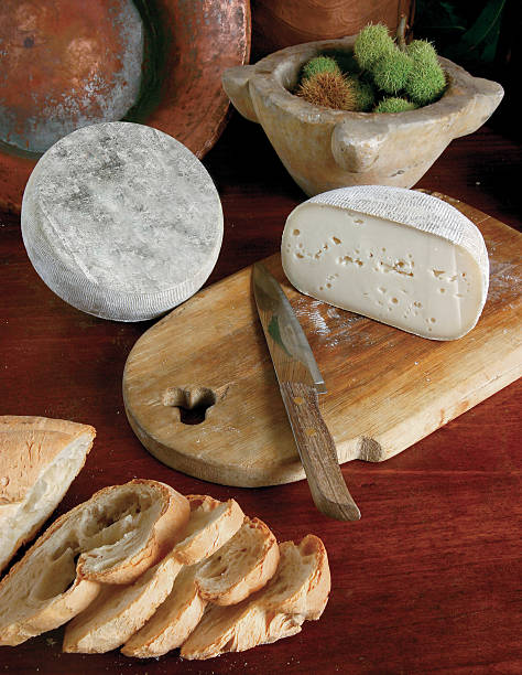 istock cheese sliced on wood background 467870240
