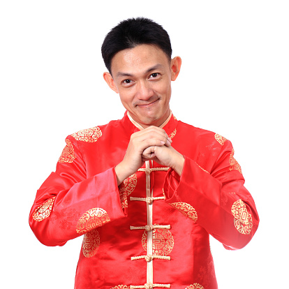 Happy Chinese new year.Young Asian man with gesture of congratulation on white background.