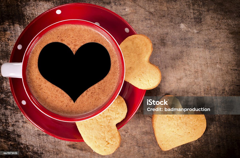 Coffee and cookies Cup of coffee and heart shape cookies on the table Cookie Stock Photo