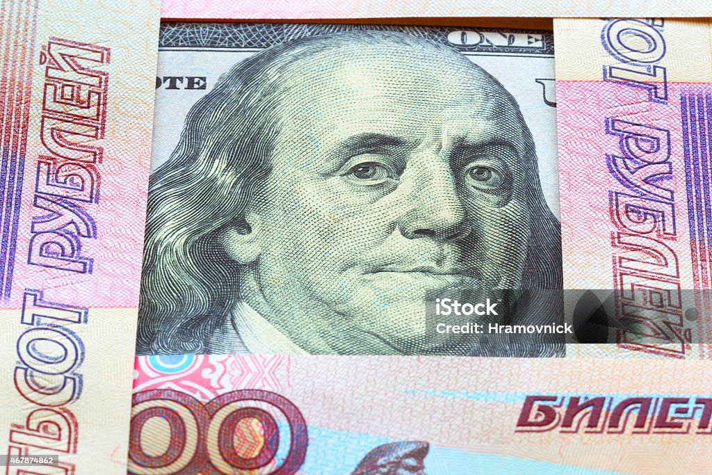 Banknotes of rubles and dollars. Banknotes of the USA and Russian Federation close up. 2015 Stock Photo