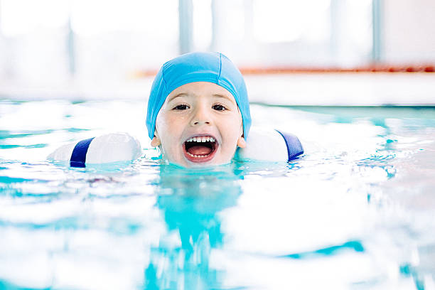 istock Little Boy Learning to Swim 467877865