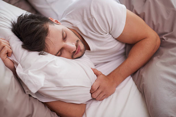 istock Tired man resting in the bed 467878508