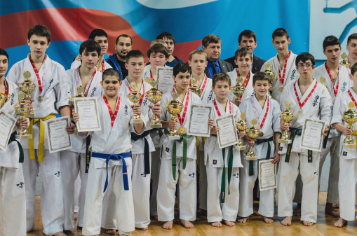 Ramenskoye, Russia - February 2, 2013: Awarding of the young athletes at the championship of Moscow region in Kyokushinkai karate in Ramenskoye, Moscow region, Russia.