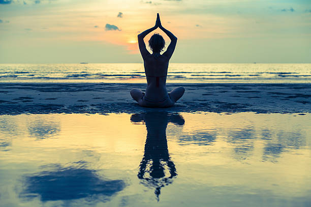 istock Silhouette young beautiful woman practicing yoga 467882694