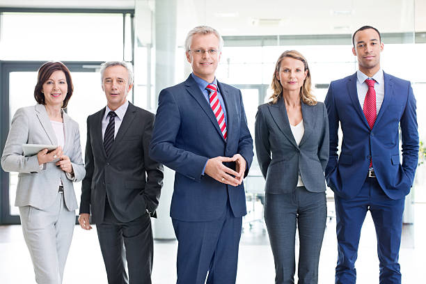 istock Successful male executive with colleagues 467882774