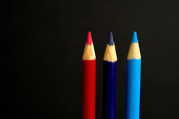 istock red, purple and blue coloured pencil crayons 467885231