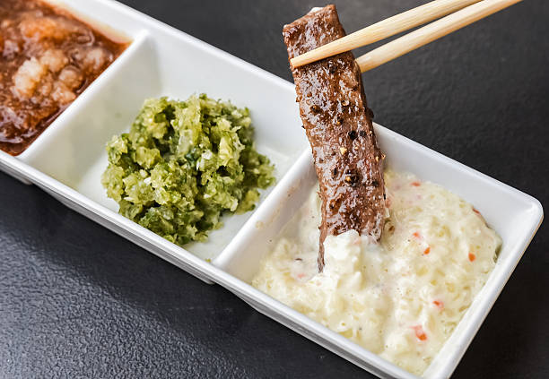 Japanese Wagyu beef with chopstick in white sauces