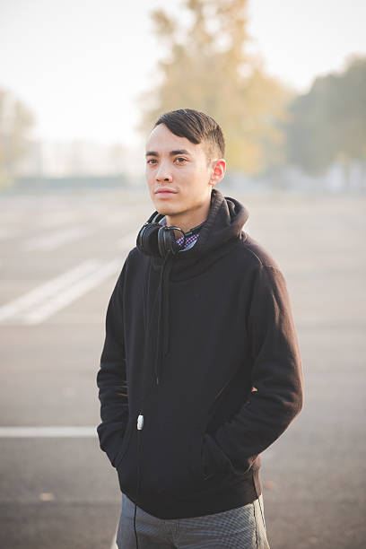 istock young crazy funny asian man in town 467893022
