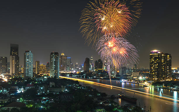 istock fireworks with cityscape river view at night scene 467893724