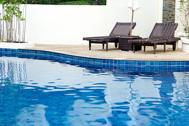 istock beach chair on swimming poll 467894336