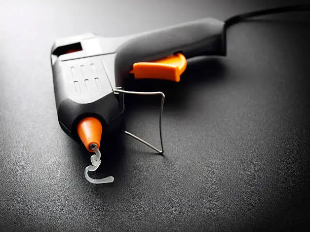 Closeup view of a modern electric glue gun.