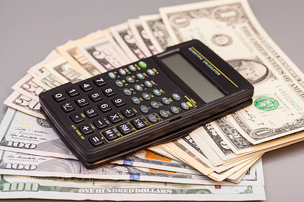 istock calculator on dollars isolated on gray background 467895104