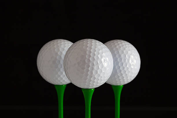 istock Golf balls and green wooden tees 467895246