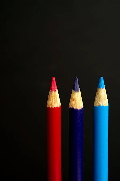 istock red, purple and blue coloured pencil crayons 467897263