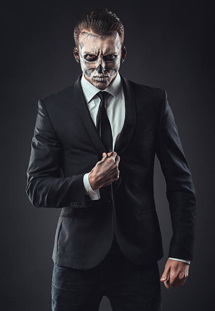 istock Portrait seriousbusinessman  makeup skeleton 467898642
