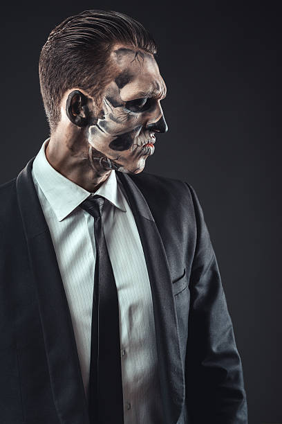 istock Portrait serious businessman  makeup skeleton 467899052
