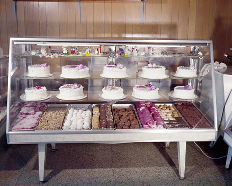 This is a realistic display for cakes from 1960. This is real raw stock photography.