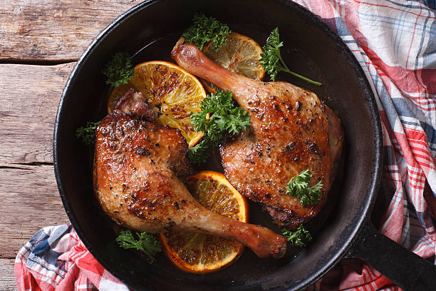 istock roasted duck legs in pan with citrus top view horizontal 467901466