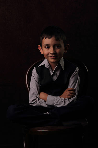 istock Happy boy sitting on a chair 467902919