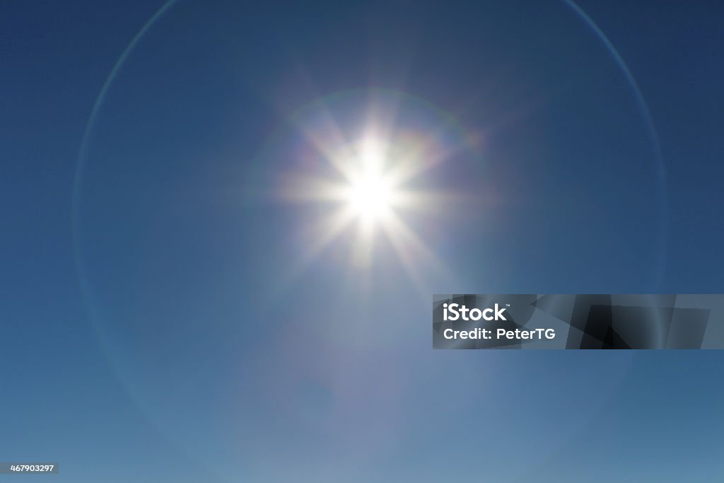 Shining sun at clear dark blue sky Shining sun at clear blue sky with lens flare and copy space, HIGH DEFINITION PHOTO Atmosphere Stock Photo