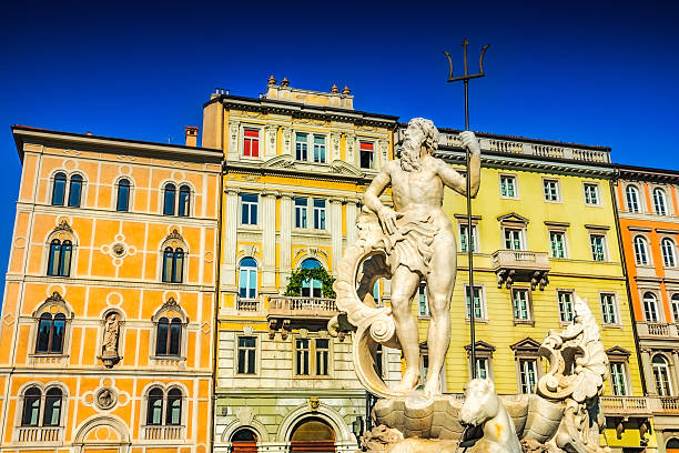 Neptune Statue in Trieste, Italy Neptune Statue in Piazza Unità d'Italia (Unity of Italy Square) at the main square of the northern Italian city of Trieste. Beautiful blue clear sky in the background. trieste stock pictures, royalty-free photos & images