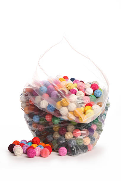 istock Crochet cotton beads in plastic bag in pinks 467906497