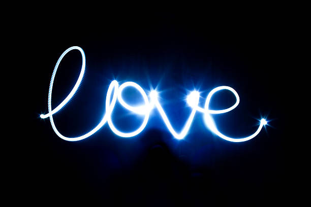 istock Glowing inscription LOVE on a black 467906881