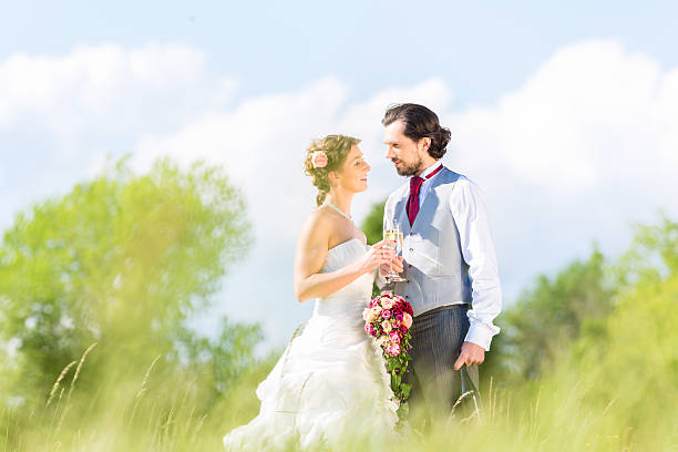 istock Bridal pair celebrate wedding day with champagne 467907084