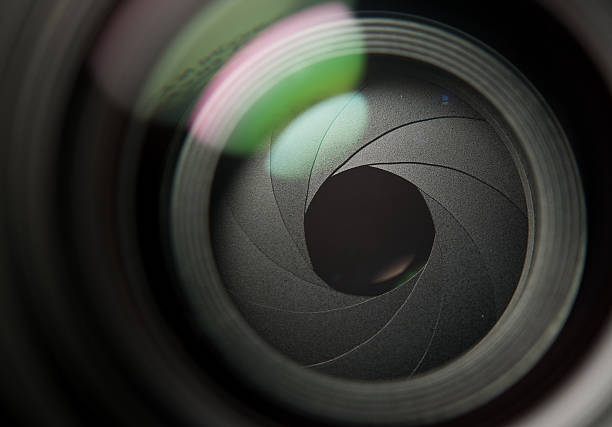 A close up of a camera lens partially open Lens front side exposed aperture blades aperture stock pictures, royalty-free photos & images