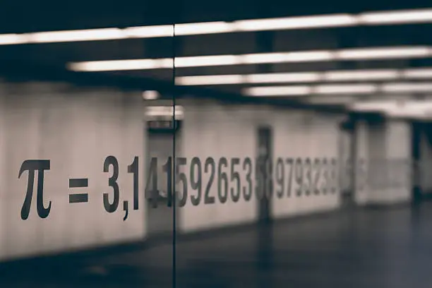 Photo of the pi symbol and numbers of mathematical constant on glass