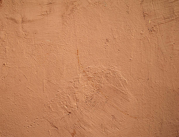 istock Texture of old wall covered with pink stucco 467911096