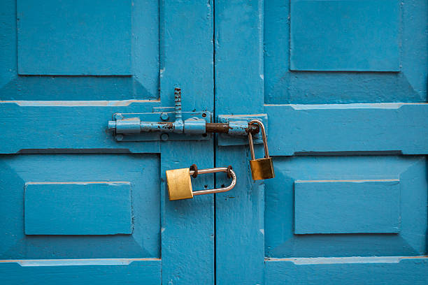 istock Blue door double lock with no smoking sign in laos 467911160