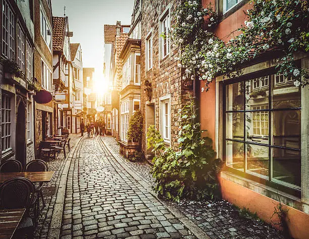Old town in Europe at sunset with retro vintage Instagram style filter effect.